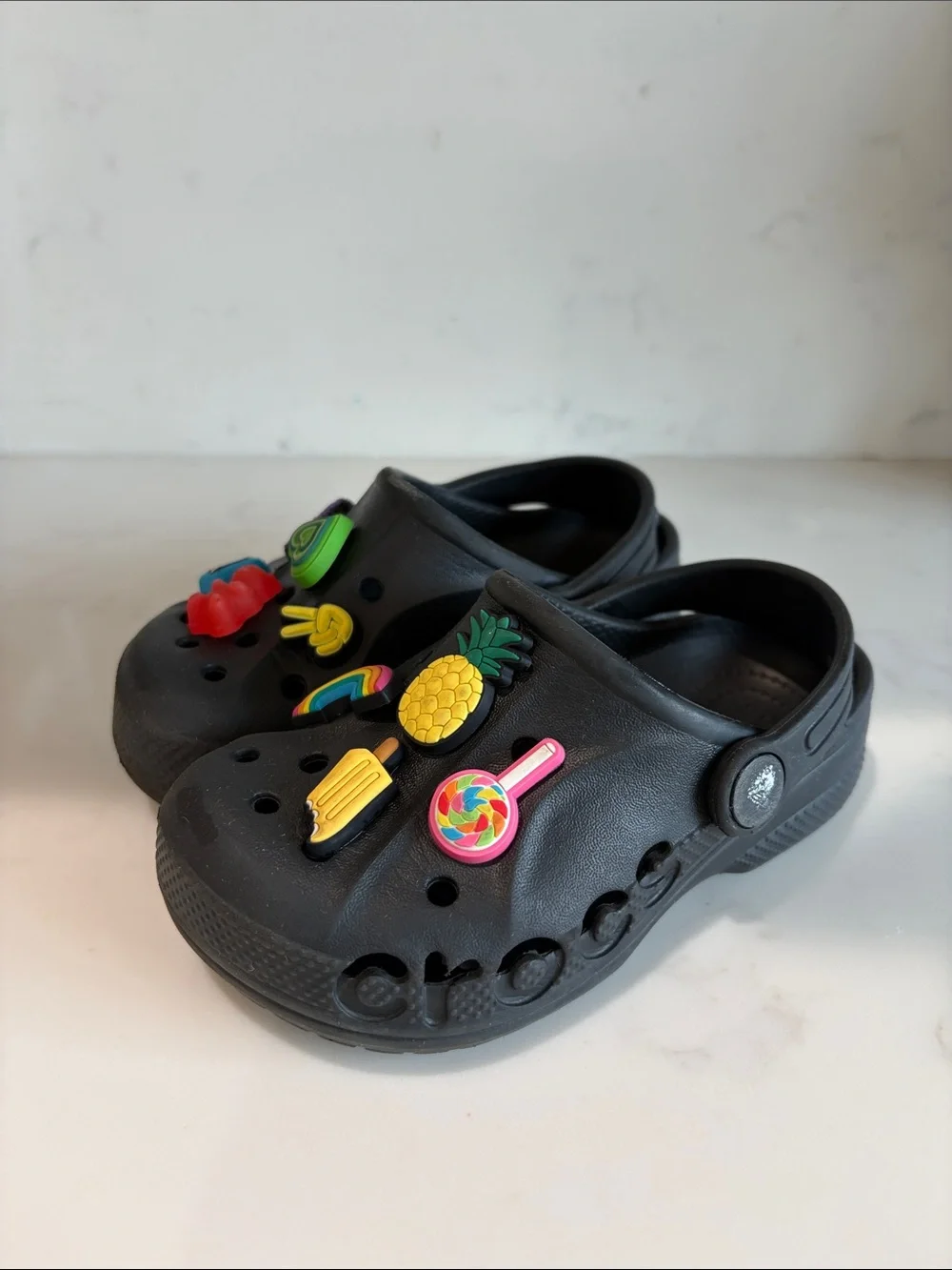 CROCS Kids Black Clogs with Colorful Charm Pins